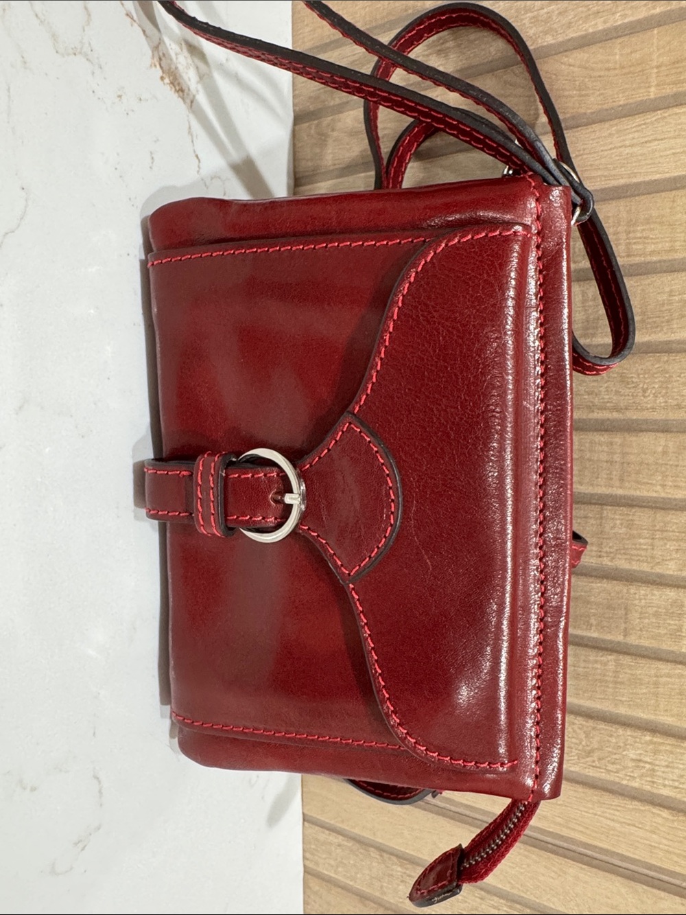 Sleek Floto Red Leather Crossbody Bag with Buckle Accent